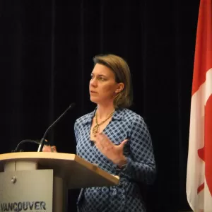 U.S. representative Pamela Franklin presenting at the GMI Expo in Canada, 2013.