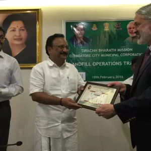 Presenting an award for landfill operations in India, 2016.